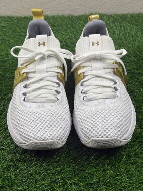Under Armour Women’s HOVR Project Rock 4 Training Sneakers in White and Gold